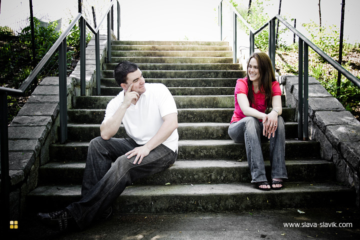 Engaged couple sitting on stairs