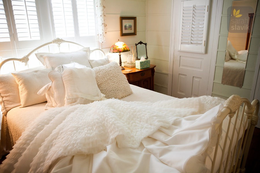 bridal dress on a bed