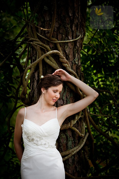 Bride by a tree with wine