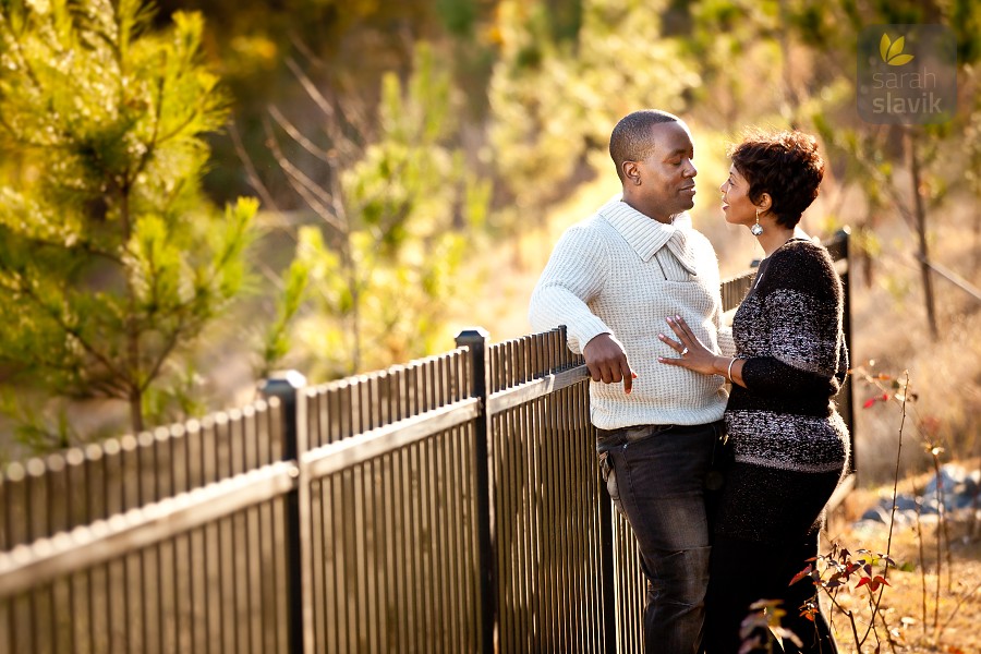 Engagement Portrait by a Fence Engagement Portrait by a Fence