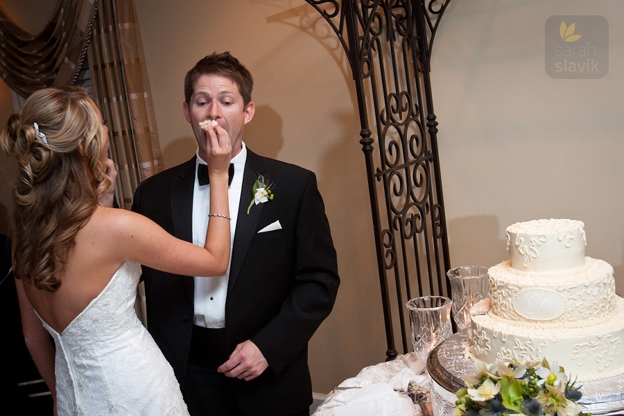 Bride and groom feed cake
