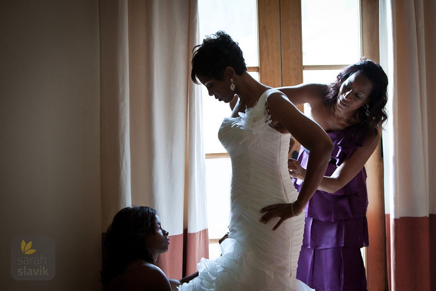 Bride puts her dress on