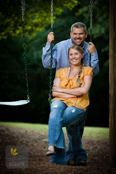 Engagement portrait on a swing