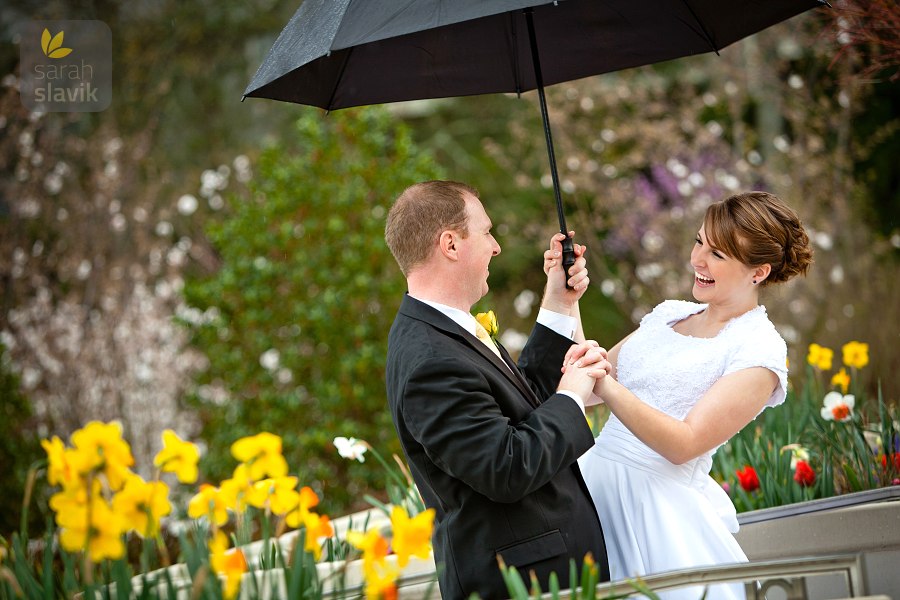 Bride and groom with umbrella