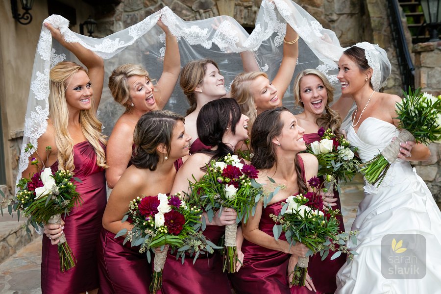 Bride with bridesmaids under veil
